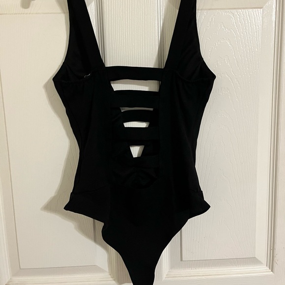 a'gaci Tops - Black bodysuit onesie
